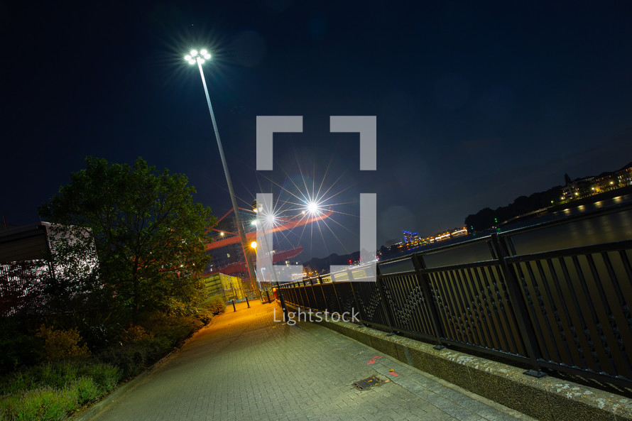 lighted path in a city at night 