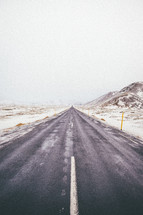 long stretch of road in winter 
