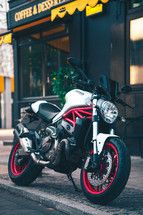 Ducati Monster 821 Italian motorcycle naked streetfighter white and red motorbike fast sports bike in an urban city setting