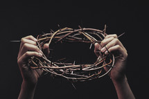 Holding Up Crown of Thorns