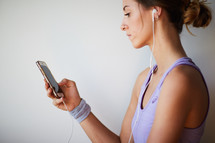 woman listening to music on an iPhone 