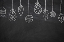 border of hanging ornaments on a chalkboard 