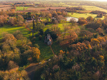 Drone photograph of a small church surrounded by beautiful countryside