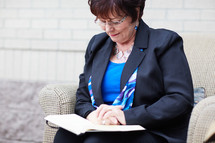 woman sitting reading a Bible 