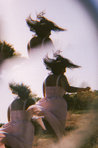 double exposure of a woman dancing 