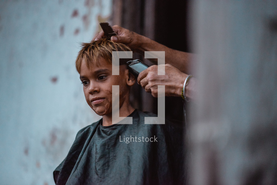 a child getting a haircut 