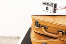 camera on stacked luggage 
