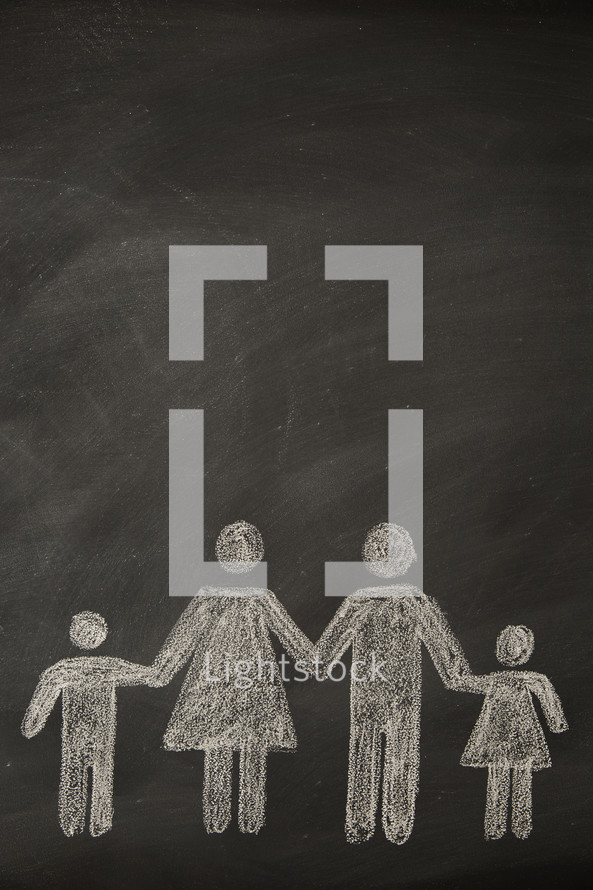 A chalkboard drawing of a family holding hands.