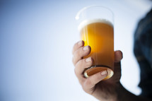 man holding a beer glass 