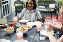 women's group Bible study around an outdoor table 