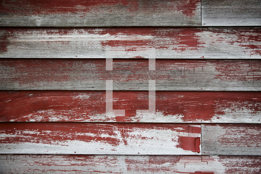 weathered wood boards and red paint 