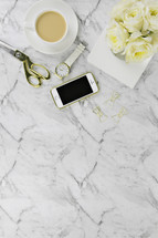 Carrara marble, iPhone, scissors, paperclips, gold, white, coffee cup, roses, watch, journal 