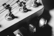 Close up from an old vintage guitar headstock , Full with dust. In black and white.