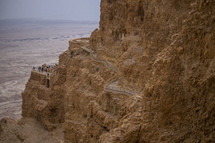 tourists on desert cliffs in Jerusalem 