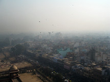 Aerial view of a mosque and the city through the haze.