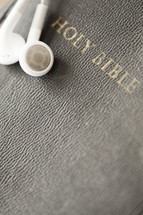 Ear buds on a Bible.