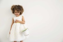 girl child holding an Easter basket 