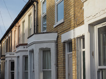 Row of traditional British houses with bow windows