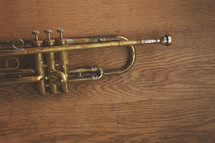 an old brass trumpet on table with copyspace