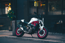 Ducati Monster 821 Italian motorcycle naked streetfighter white and red motorbike fast sports bike in an urban city setting