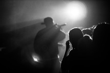 Silhouette of audience at a concert.