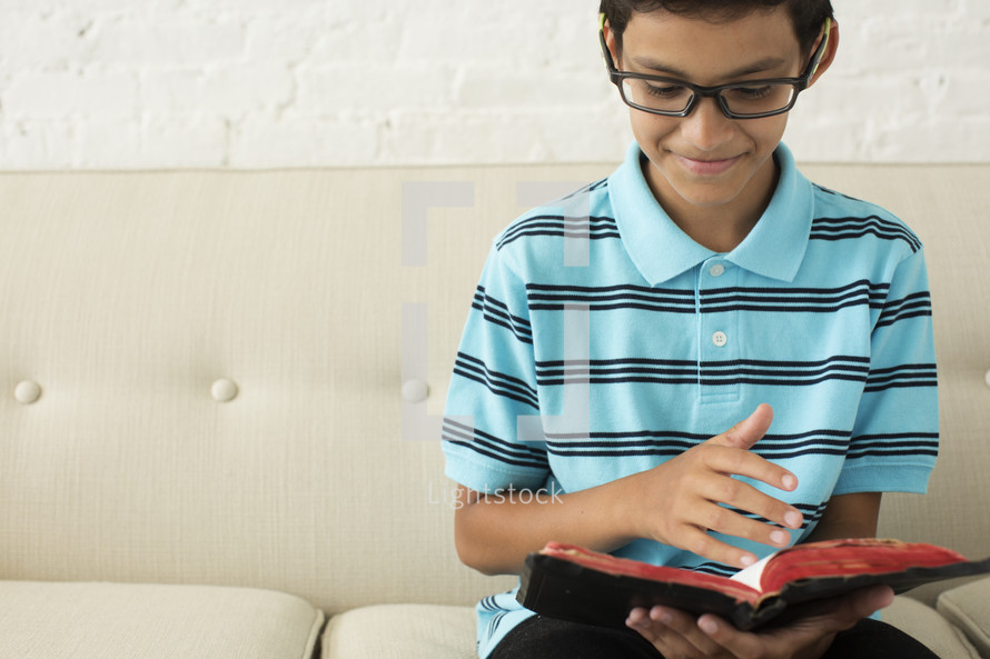 boy reading a Bible 