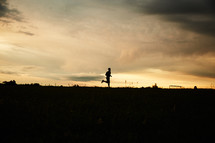 silhouette of a man running 