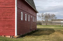 old red barn near fields
