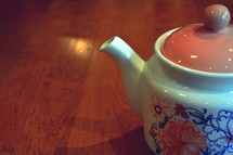 tea pot on a wood table 