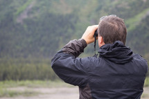 a man with binoculars 