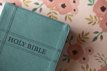 turquoise Bible on floral pattern 