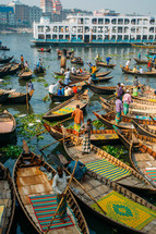 Boats with fishermen in Dhaka river in Bangladesh