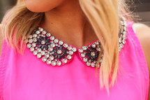 beaded collar on a pink shirt 
