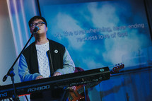 musician playing a keyboard during a worship service 
