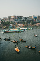 Boats with fishermen in Dhaka river in Bangladesh