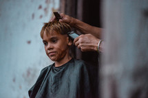 a child getting a haircut 