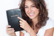woman holding a Bible