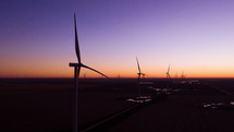 Aerial shot of wind turbines at sunrise.