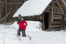 boy child throwing a snowball 
