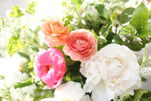 white, peach, and pink flower arrangement 
