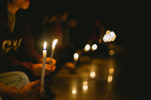 holding candles 