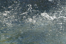 water surface with sparkling reflections of sunlight