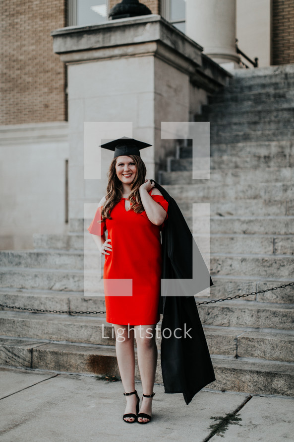 a woman in a red dress at graduation 