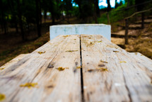top of a wooden picnic table 