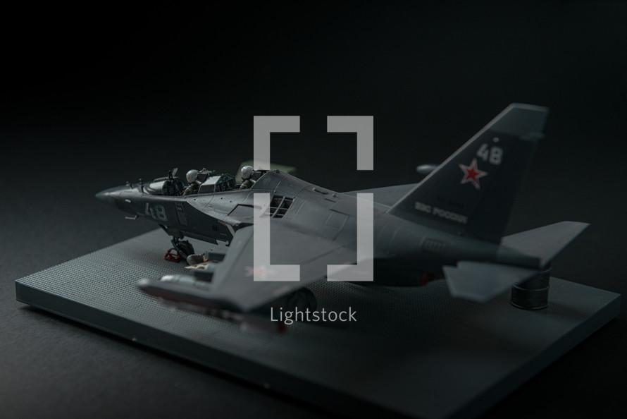 RUSSIA / YAK-130 - 2019. Miniature of military fighter on a black background with place for text