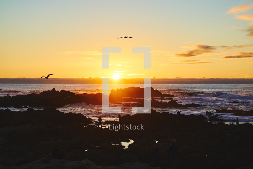 sunset over a rocky shore 