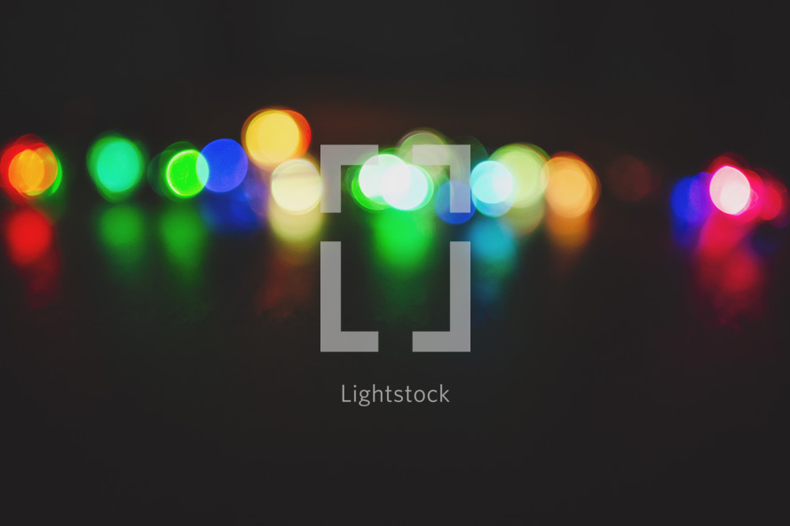 a simple row of coloured lights out of focus