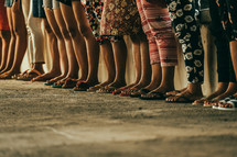 legs and feet of women in a line 