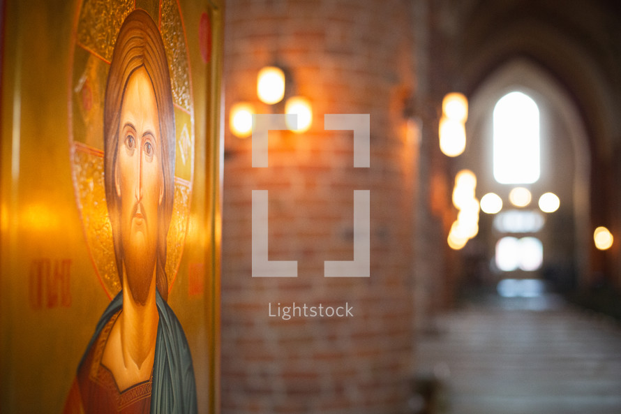 An icon of Christ in a church hallway 