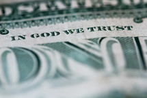 one dollar bill with In God We Trust 